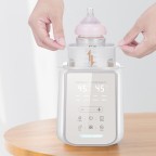 Portable constant temperature controlled milk warmer